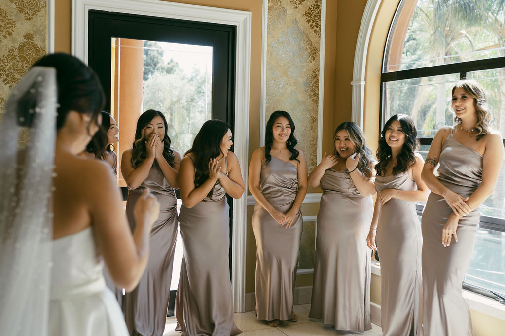 brides first look with her bridesmaids