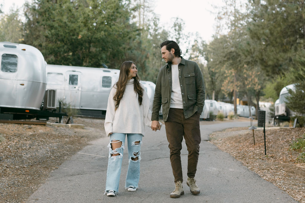 couple posing for their engagement photos at a campsite near yosemite | Intimate + Romantic Engagement Photo Ideas at AutoCamp Yosemite
