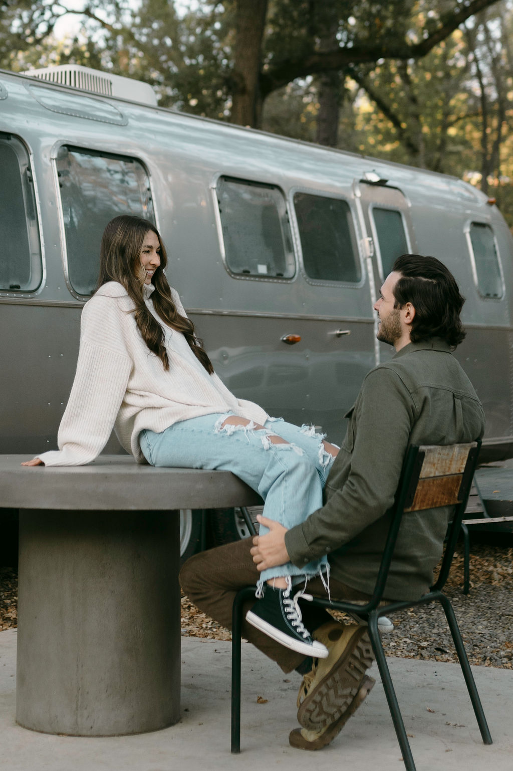 couple posing for their engagement photos at a campsite near yosemite