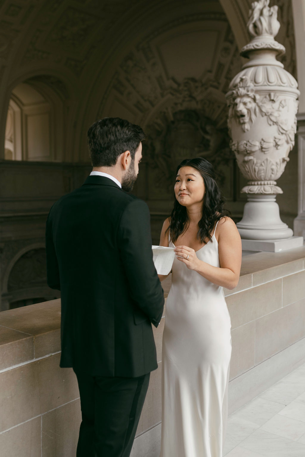 couple posing for their elopement photos - sf city hall elopement